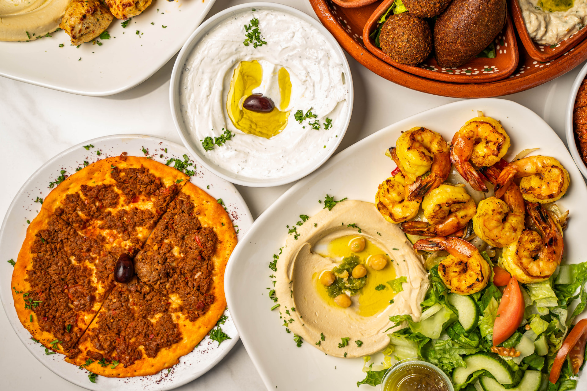 Shrimp hummus plate, labneh and safeiha at Mona's Cafe