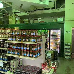 Fresh-baked Mediterranean pita bread and grocery shelves at Mona's Cafe